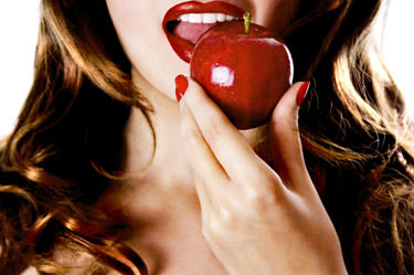 sexy girl eating an apple